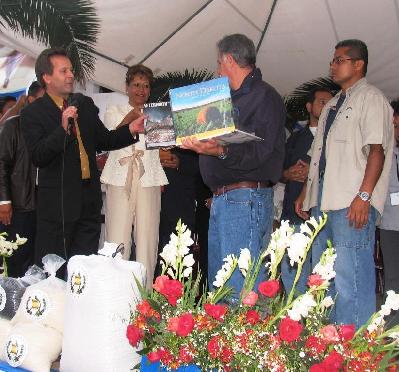 GOD'S CHILD Project founder Patrick Atkinson presents Guatemalan President Oscar Berger with a book signed by North Dakota Governor John Hoeven and First Lady Mikey Hoeven